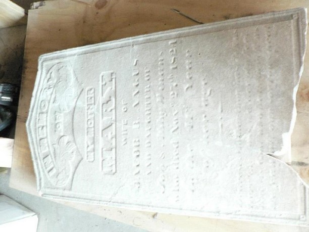 Damaged grave marker, after conservation